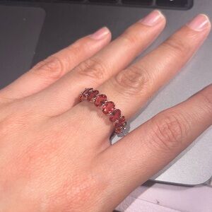 Silver plated ring with red gem stones